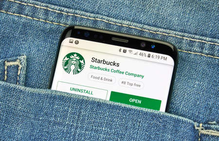 MONTREAL, CANADA - December 23, 2018: Starbucks android app and logo on Samsung s8 screen. Starbucks Corporation is an American coffee company and coffeehouse chain.のeditorial素材