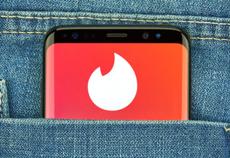 MONTREAL, CANADA - December 23, 2018: Tinder android app and logo on Samsung s8 screen. Tinder is a...