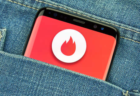 MONTREAL, CANADA - December 23, 2018: Tinder android app and logo on Samsung s8 screen. Tinder is a location-based social search mobile app and dating search application and siteのeditorial素材