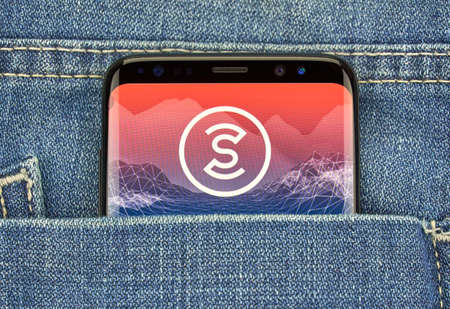 MONTREAL, CANADA - December 23, 2018: Sweatcoin android app and logo on Samsung s8 screen. Sweatcoin is a digital currency -cryptocurrency that you earn by walking or running.のeditorial素材