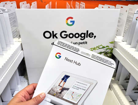 MONTREAL, CANADA - JUNE 20, 2019: Google Nest Hub device and stand at costco. The Google Nest Hub is a Google Assistant smart display with a camera on top. Google is an American technology company.のeditorial素材