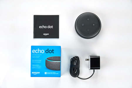 MONTREAL, CANADA - DECEMBER 17, 2018: Amazon Echo Dot unboxed over white background. Amazon Echo and Echo Dot are a brand of smart speakers developed by Amazon.のeditorial素材