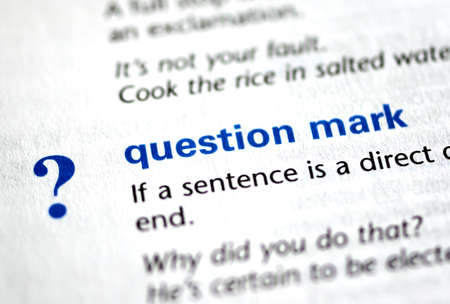 MONTREAL, CANADA - JULY 17, 2019: word and symbol question mark in a dictionay with meaning. Close-up and selective focus.のeditorial素材