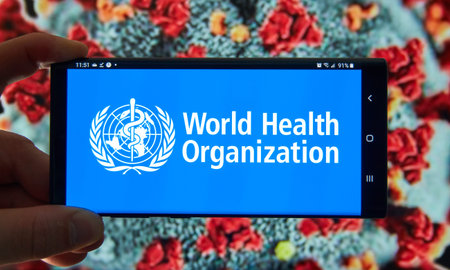 Montreal, Canada - March 21, 2020: The World Health Organization logo on mobile screen. The World...