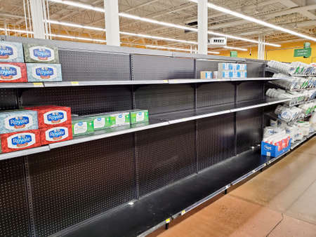 Montreal, Canada - March 22, 2020: Empty shelves in Walmart grocery store because of COVID-19. Many people around the world have encountered long lines and empty shelves at grocery stores due to coronavirusのeditorial素材