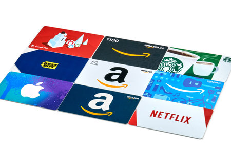 Montreal, Canada - April 9, 2020: Different gift cards of many brands such as Amazon, Netflix, Xbox,...