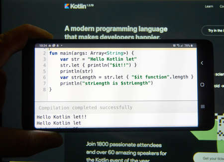 Montreal, Canada - March 08, 2020: Kotlin code example on a mobile phone screen. Kotlin is a modern popular cross-platform, statically typed, general-purpose programming languageのeditorial素材