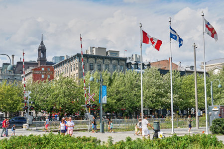 Canada, Montreal - July 11, 2021: Scenic view of Old Port of Montreal. Old Port is historic place, located in between Old Montreal and the St. Lawrence River. The site is very popular touristic placeのeditorial素材