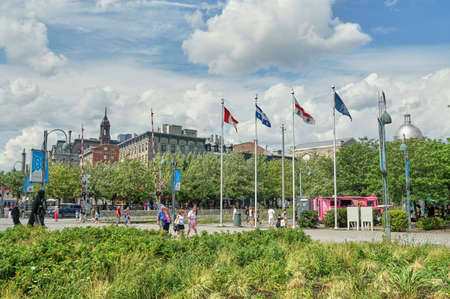 Canada, Montreal - July 11, 2021: Scenic view of Old Port of Montreal. Old Port is historic place, located in between Old Montreal and the St. Lawrence River. The site is very popular touristic placeのeditorial素材