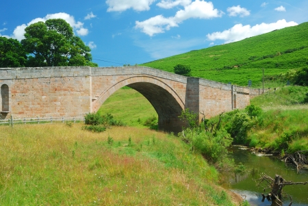 stone bridge and stream east of Wooler, Northumberlandの写真素材