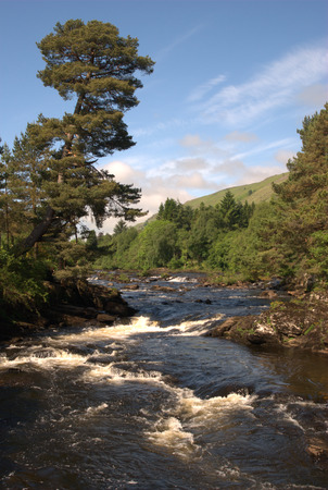 Falls of Dochart at Killin in Scotland looking upriverの写真素材