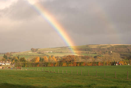 rainbow over the fields at Darnick, Scotlandの写真素材