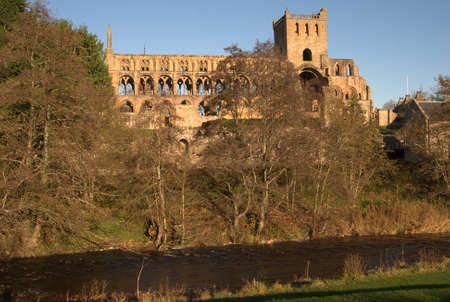 Jedburgh Abbey and Jed Water in early sunshineの写真素材
