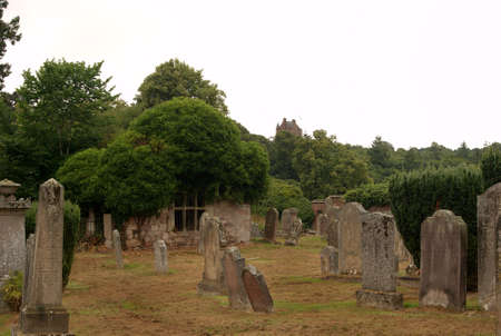 Ayton cemetery ruin and Castle tower Berwickshire on dull dayの写真素材