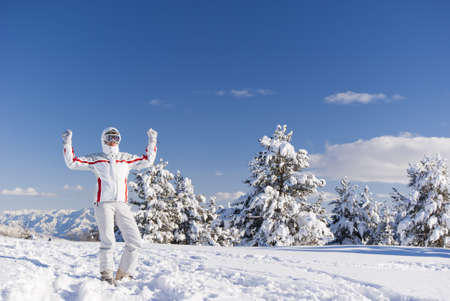 Success skier with confidence on the top of mountainの写真素材
