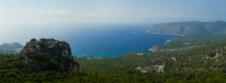 Venetian castle of Monolithos on top of a mountain. Agios Georgios bay. Rhodes, Greece, Europe の写真素材