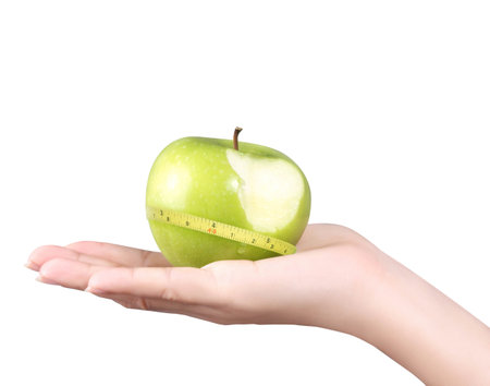 hand with green apple isolated on white background