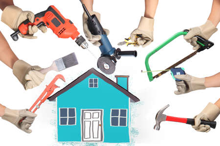 Selection of tools in the shape of a house, home improvement concept Selection of tools in the shape of a house, home improvement concept