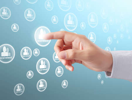 Hand pressing modern social buttonsの写真素材