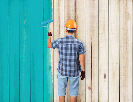Men painting and paint brush houseの写真素材