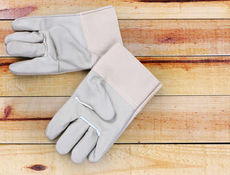 Gloves on the wood backgroundの写真素材