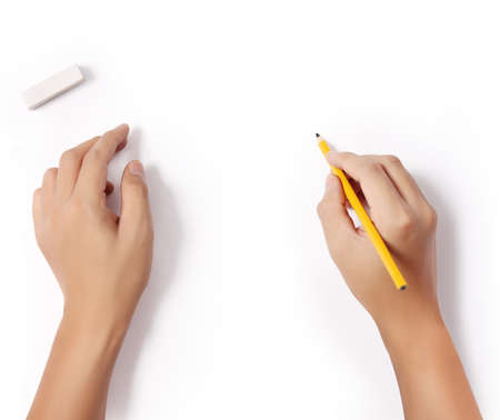 hands with pencil and erase rubber writting something の写真素材