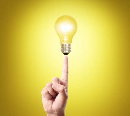 bulb light on women fingertip ,handの写真素材