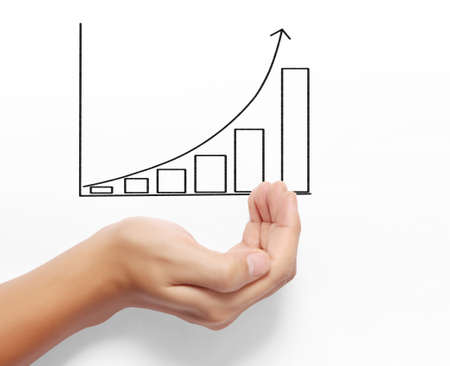 Business man drawing a graph  in handの写真素材