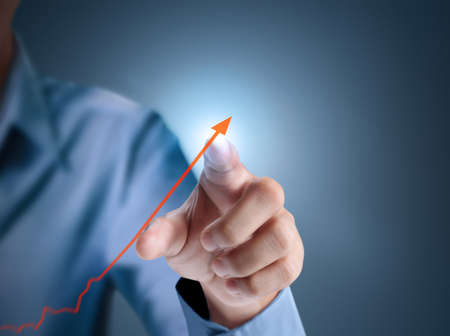 Business man pushing a graph の写真素材