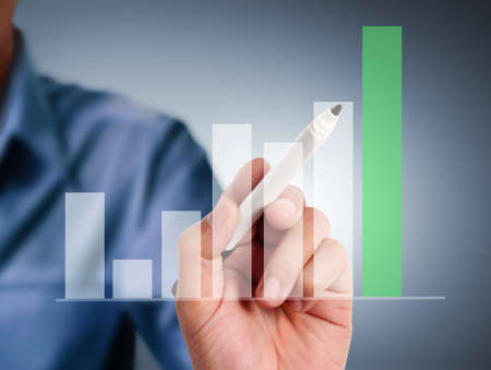 Business man drawing a graph の写真素材