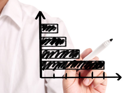 Business man drawing a graph 