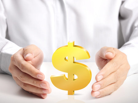 Man's hand holding Golden dollar symbol の写真素材