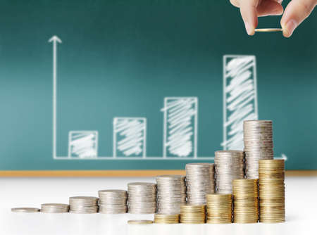 Hand put coin to money ,Business idea の写真素材