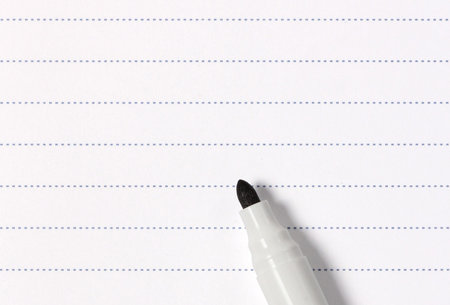 Photo of blank squared the graph paper with a yellow pencil