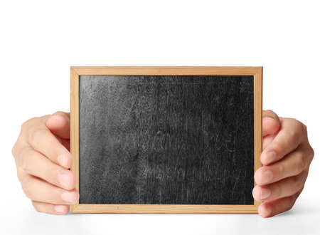 holding blank chalkboard in handの写真素材