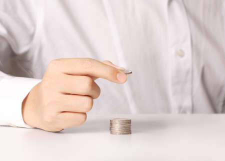 Hand put coin to money ,Business idea の写真素材