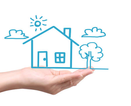 holding house representing home ownership and the Real Estate business の写真素材