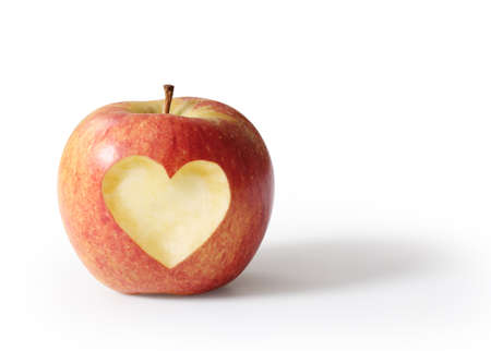 apple with heart shape Isolated on white background の写真素材