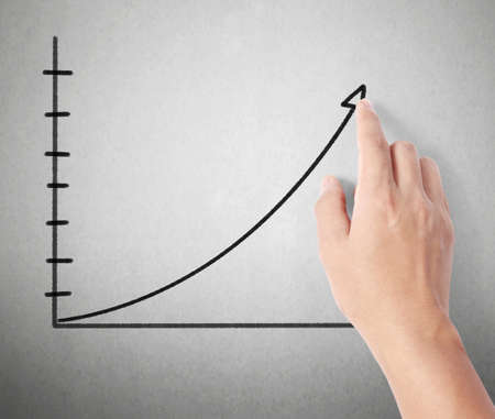 Business man pushing the graph の写真素材
