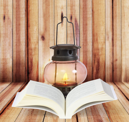 Open book on wood planks background の写真素材