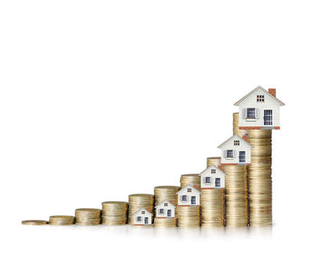 Mortgage concept by money house from the coins の写真素材
