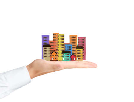 holding house representing home ownership and the Real Estate business の写真素材