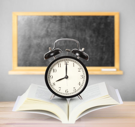 Open book on wood planks background の写真素材