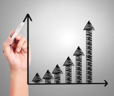 Business man drawing a graph 