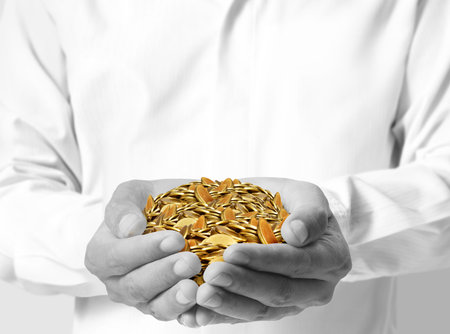 close up coins in his handsの写真素材