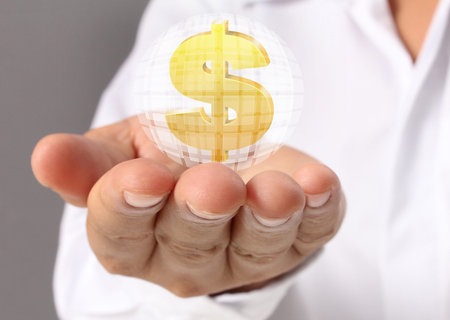 Man's hand holding Golden dollar simbol 