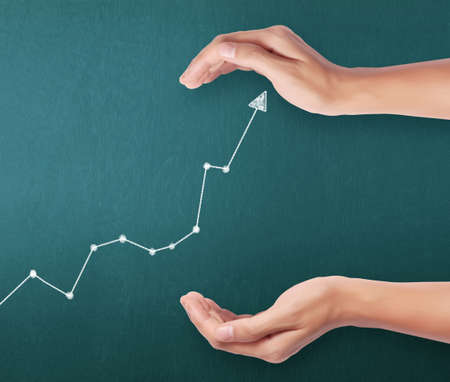 Business concept,  man with financial symbols coming from hand の写真素材