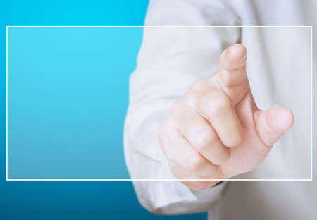 Hand pushing a button on a touch screen interfaceの写真素材