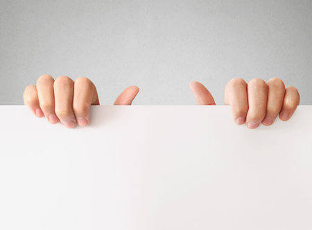 Businessman holding a white board