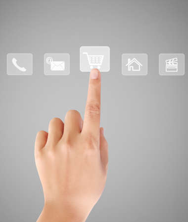 Business man pressing a touchscreen buttonの写真素材